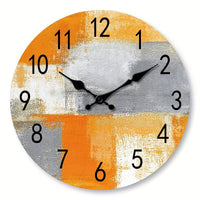 une horloge murale vintage couleur orange grise blanche des années 70