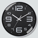 Horloge murale ronde noire au design contemporain, cadran sombre et aiguilles blanches pour une cuisine ou un salon contout cadran blanc
