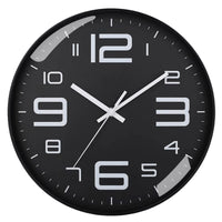 Horloge murale ronde noire au design contemporain, cadran sombre et aiguilles blanches pour une cuisine ou un salon