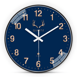 Horloge murale ronde bleu roi de 30 cm au design moderne et classique, avec aiguilles blanches et chiffres dorés, décoration simple et élégante pour chambre, salon ou cuisine.