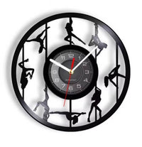 Horloge murale disque vinyle ajourée avec multiples figures pole dance silhouettes.