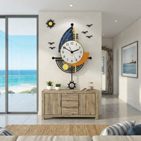 Pendule murale moderne en forme de voilier installée dans un salon lumineux avec vue sur la mer et meuble en bois naturel