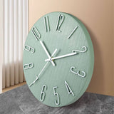 Horloge murale verte sauge  de 30 cm avec aiguilles et chiffres blancs, style moderne et design, décoration pour salon, chambre ou cuisine.
