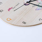horloge murale licorne silencieuse design avec des fleurs