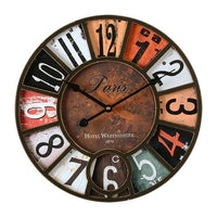 Horloge vintage industrielle colorée style rétro de 40 cm avec un cadran original aux chiffres divisés en plusieurs parties colorées. Ses tons orange, blanc, beige, noir et gris avec un effet vieilli apportent un design unique et plein de caractère. L’inscription « Paris » au centre du cadran ajoute une touche urbaine et élégante à cette décoration murale. Son contour noir et ses deux aiguilles noires complètent parfaitement son style industriel. Fonctionnant avec un mécanisme à pile.