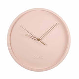 Horloge murale style scandinave et nordique avec quartz comme mécanisme sans bruit tic-tac pour installer dans un salon ou une cuisine moderne couleur rose