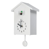 Horloge coucou moderne blanche avec pendule minimaliste avec mécanisme silencieux et oiseau chantant