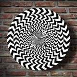 horloge murale avec illusion d'optique noire et blanche
